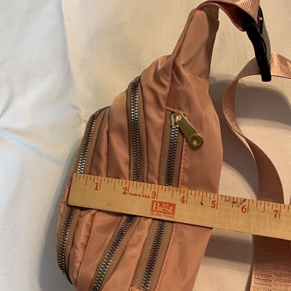 Light pink sling bag with for zipper closure pockets. NWT from local boutique. - Picture 9 of 10